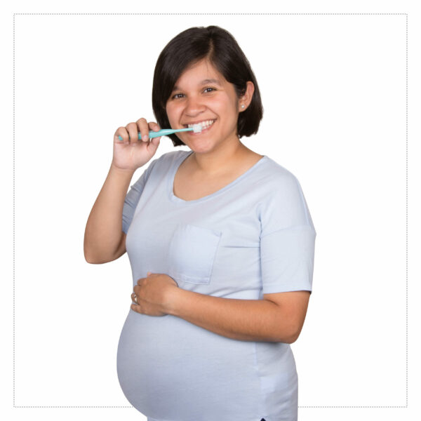 Pregnant Woman with Brilliant Oral Care Round Toothbrush